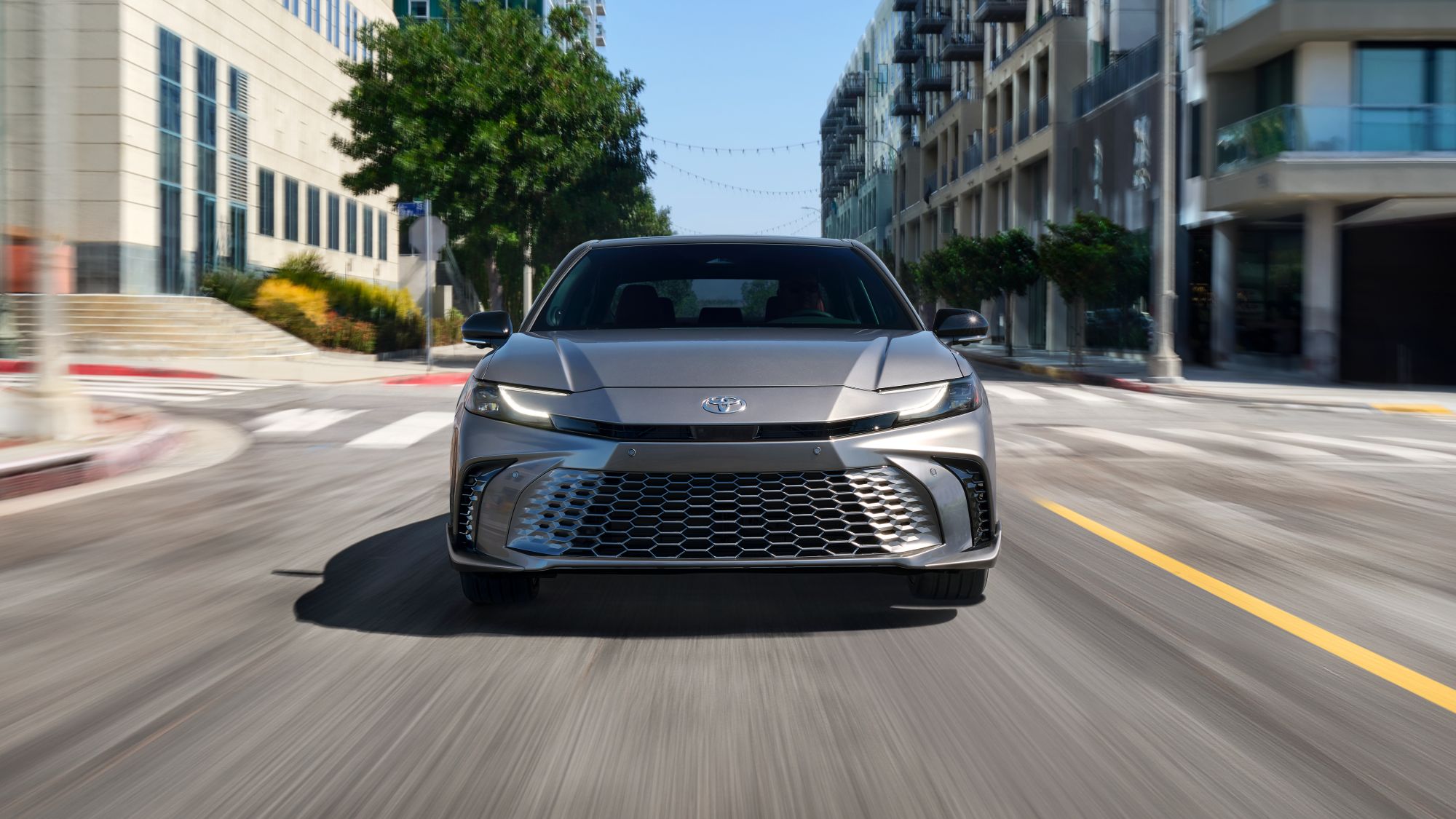 2025 Toyota Camry Gray Camry driving on city streets