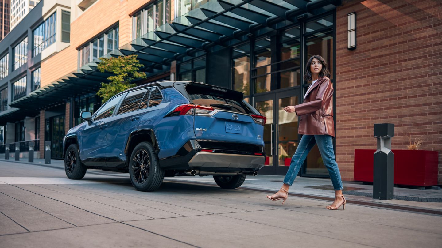 2025 Toyota RAV4 Hybrid 2025 Toyota RAV4 Hybrid XSE parked next to city sidewalk