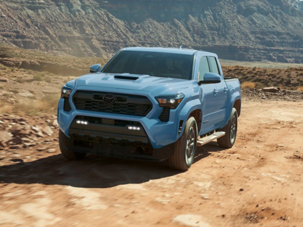2026 Toyota Tacoma i-FORCE MAX Blue 2026 Toyota Tacoma i-FORCE MAX driving in the dessert