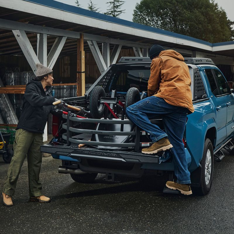 Toyota Tacoma with its tailgate open and cargo in the bed