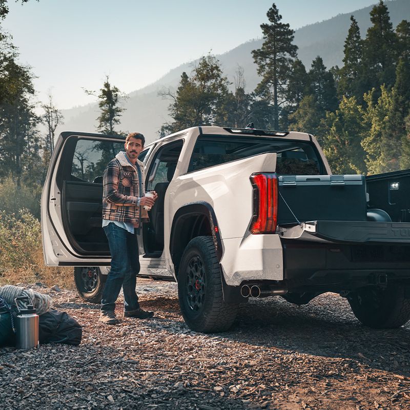 Toyota Tundra with its tailgate open at a campsite
