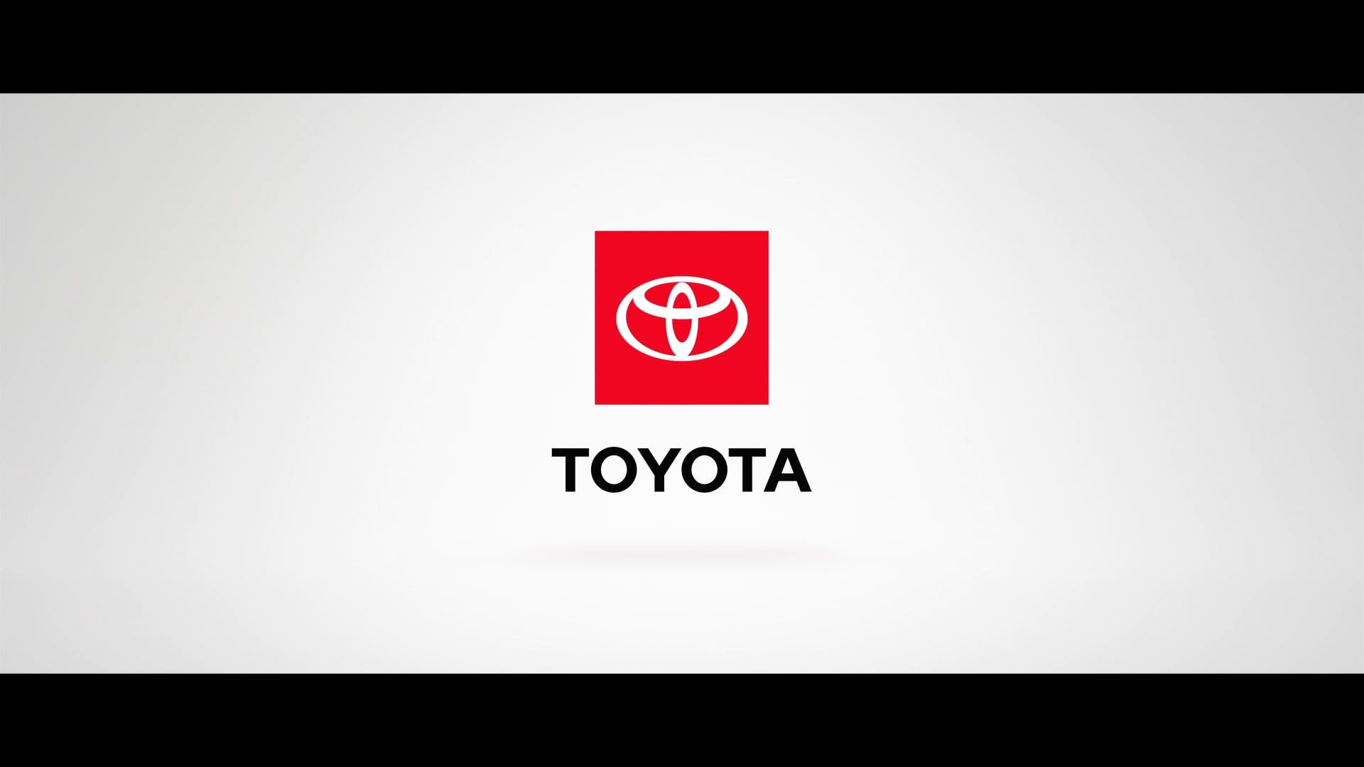 Toyota logo on white background in letterbox format with a black band at top and bottom of the image.