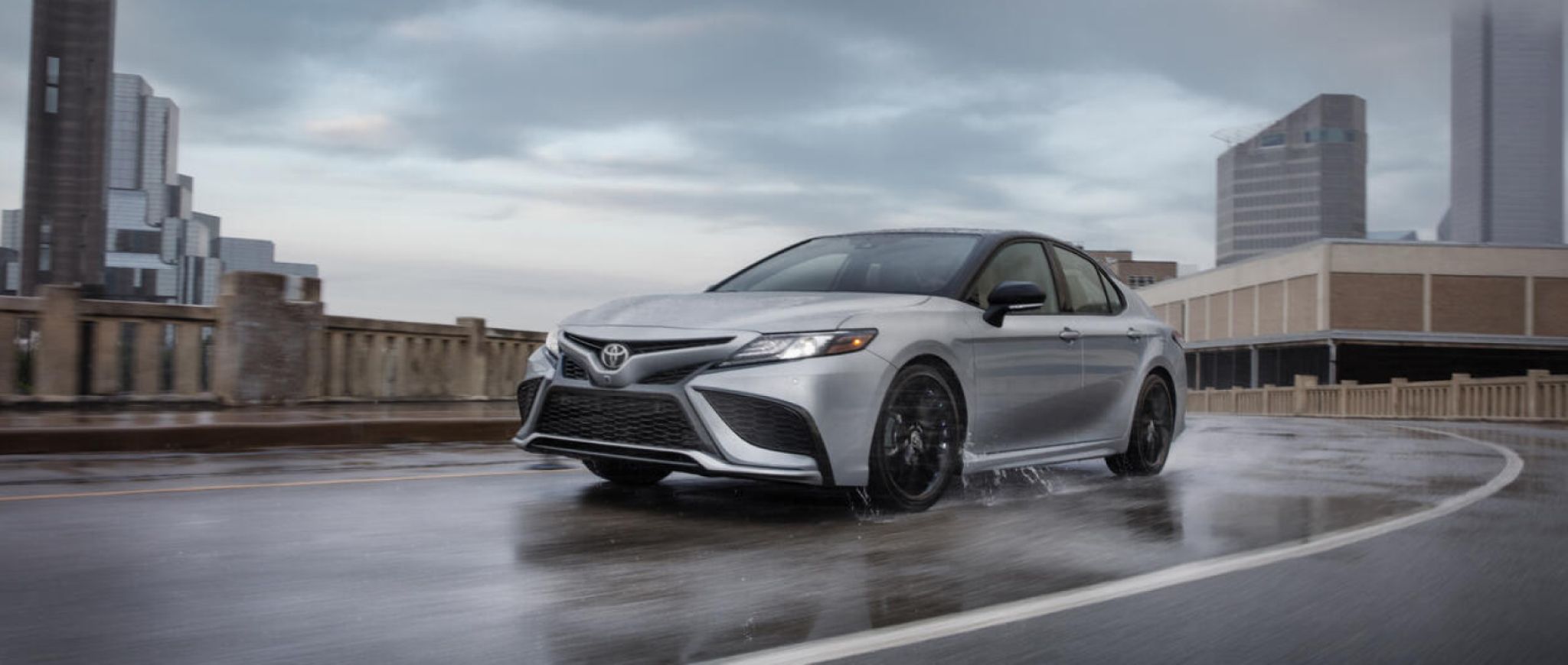 A 2022 Toyota Camry XSE on a rain-covered street