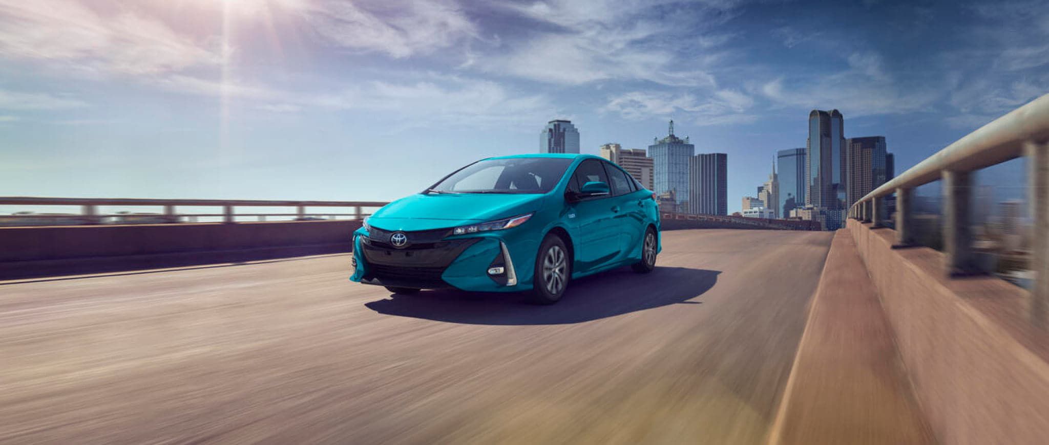 A 2022 Toyota Prius Prime driving on a highway.