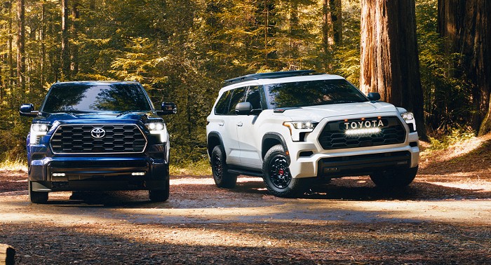 2023 Toyota Sequoia Capstone 4x4 shown in Supersonic Red, Platinum 4x4 shown in Blueprint, and TRD Pro shown in Ice Cap.