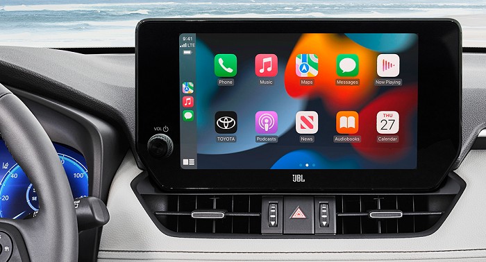Apps appear on a touch screen display viewed from the interior of the vehicle.