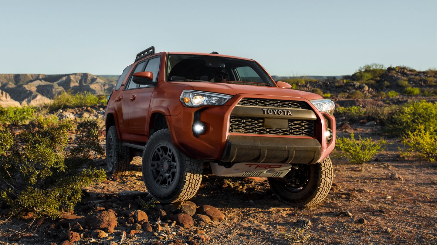 Red TRD Toyota 4 Runner off roading in the desert