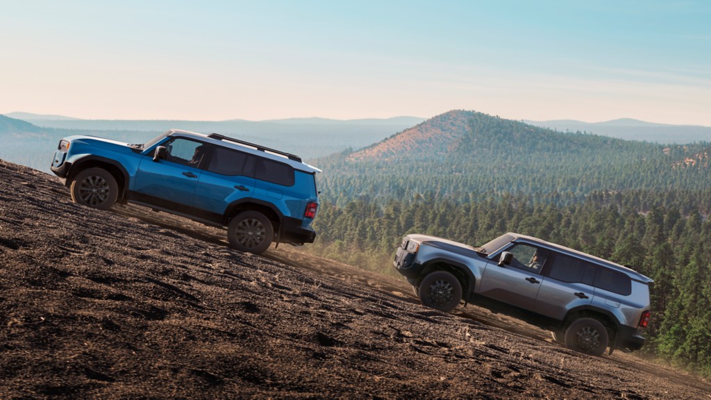 two New Toyota 2024 and 2025 Land Crusiers trailing up a steep mountain