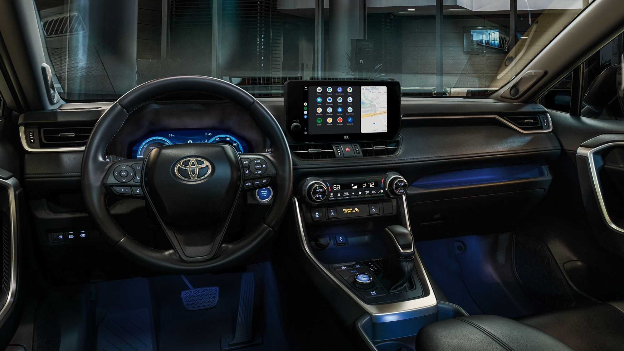 cockpit view of the black/blue SofTex Hybrid RAV4 XSE Advanced Technology Package with 11 JBL speakers