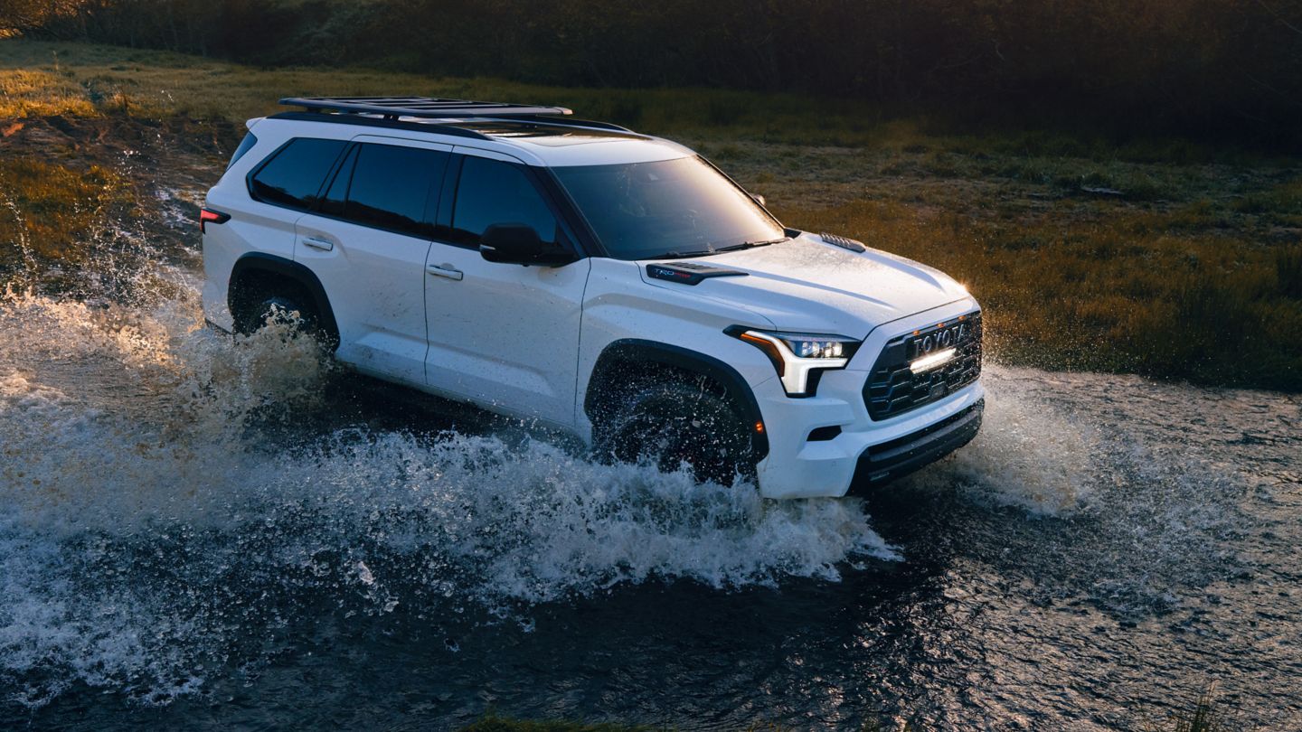 White 2024 Toyota Sequoia dashing through a river