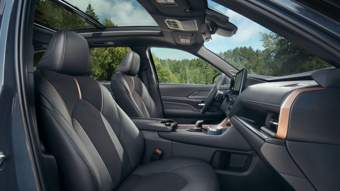 Passenger door view of the Grand Highlander front seat interior