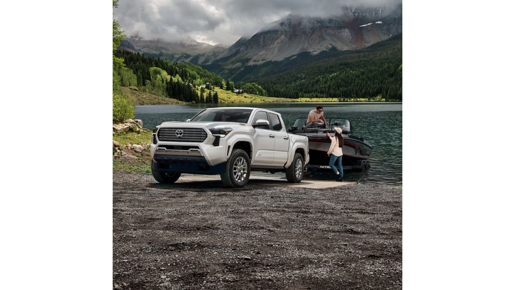 2025 Toyota Tacoma towing a mid sized boat