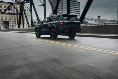 Toyota 4Runner crossing a city bridge