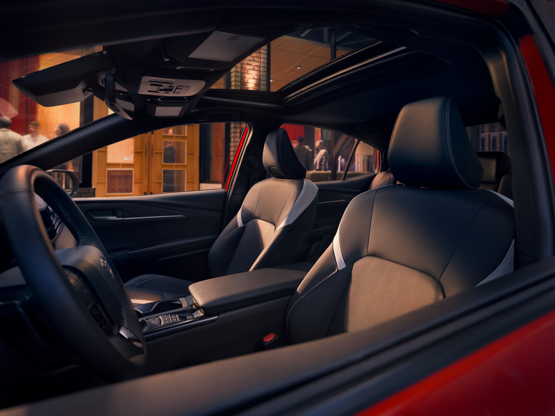Front seats of a 2026 Toyota Camry seen through the open driver's door
