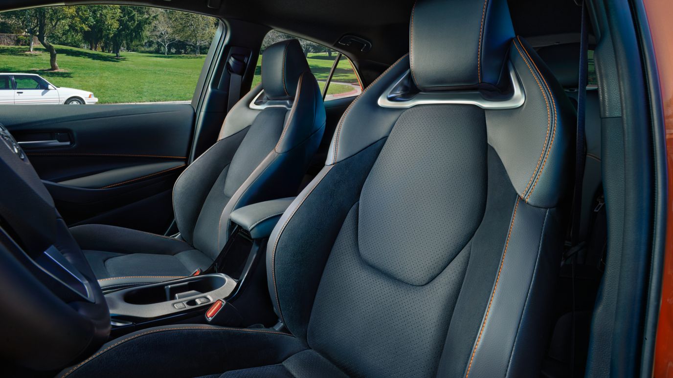 Corolla hatchback black synthetic leather interior with orange stiching