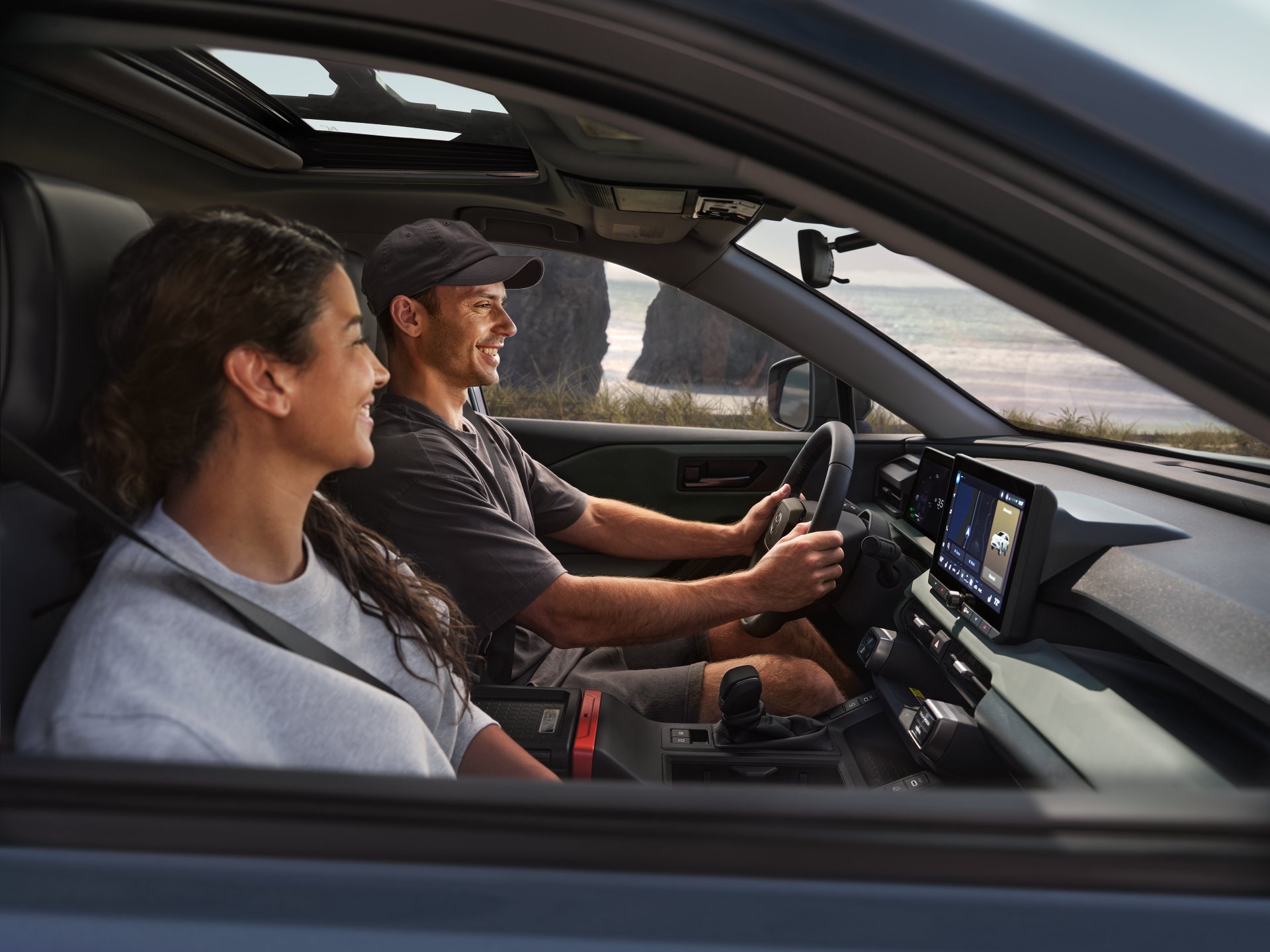 Illustrative: a couple riding in the front seats of a Toyota RAV4