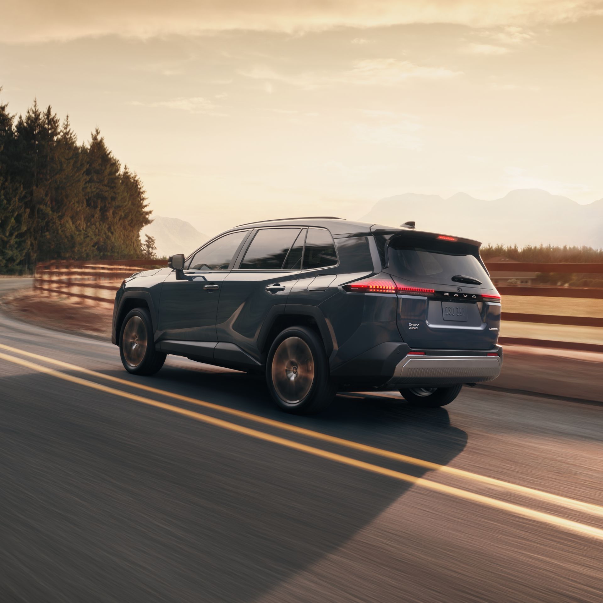 Official Toyota image showing the rear of a 2026 RAV4 at sunset