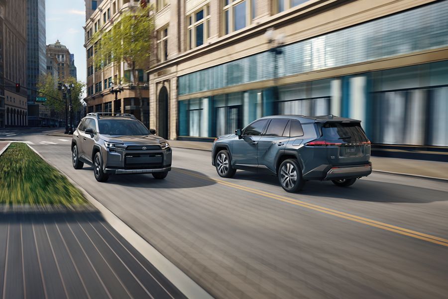 Two Toyota RAV4s on a city street