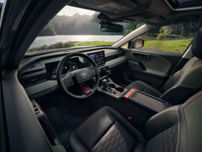 Official Toyota image of the 2026 RAV4 Plug-in Hybrid Woodland interior in Mineral SofTex trim