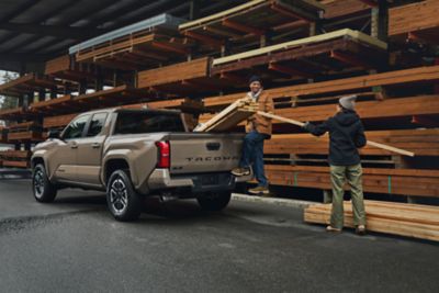 Loading lumber into a Toyota Tacoma