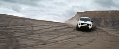 Toyota Tacoma kicking up dust in the desert