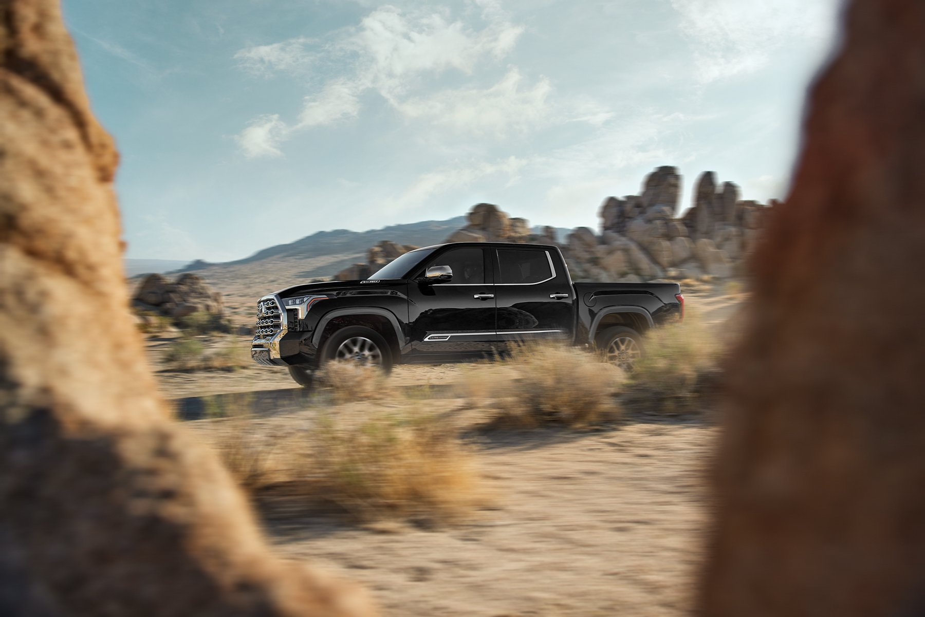 Black Toyota Tundra driving through the desert