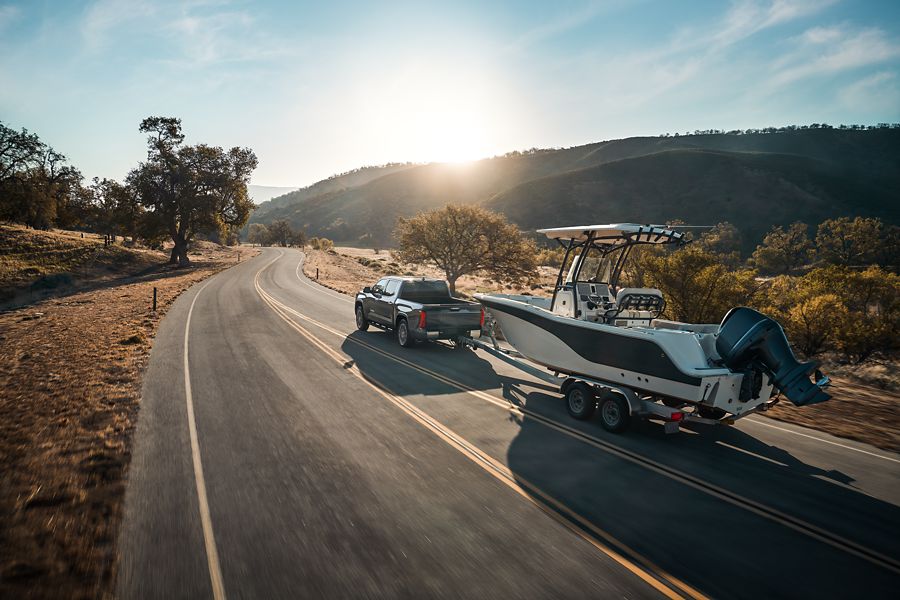 Toyota Tundra towing a boat at sunset